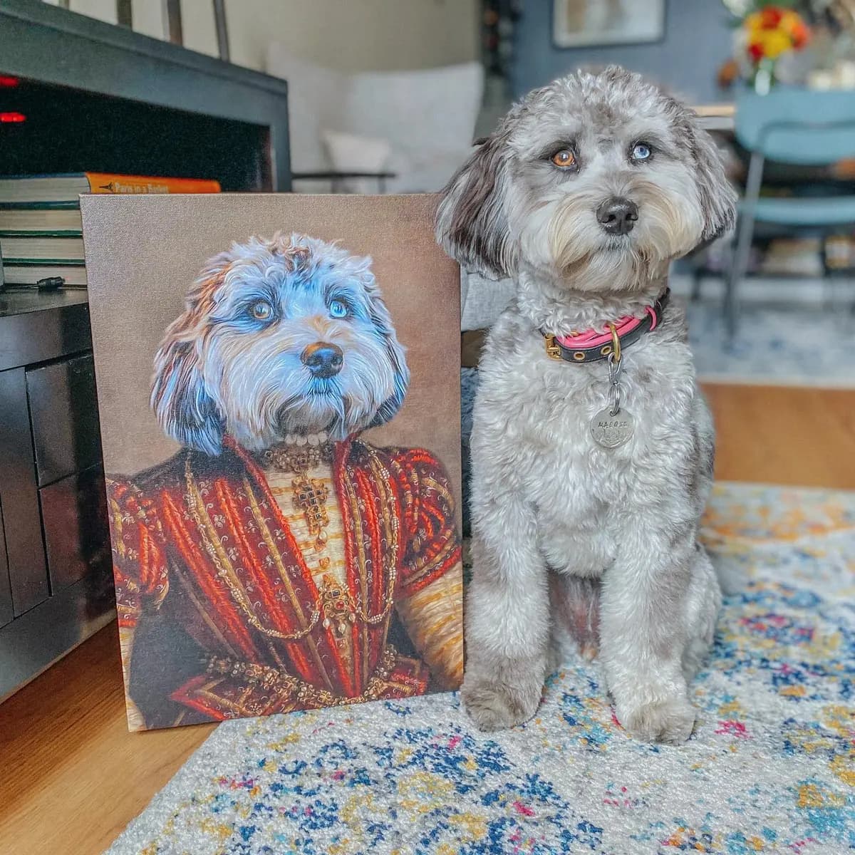 Two dogs posing beside their personalized pet portrait